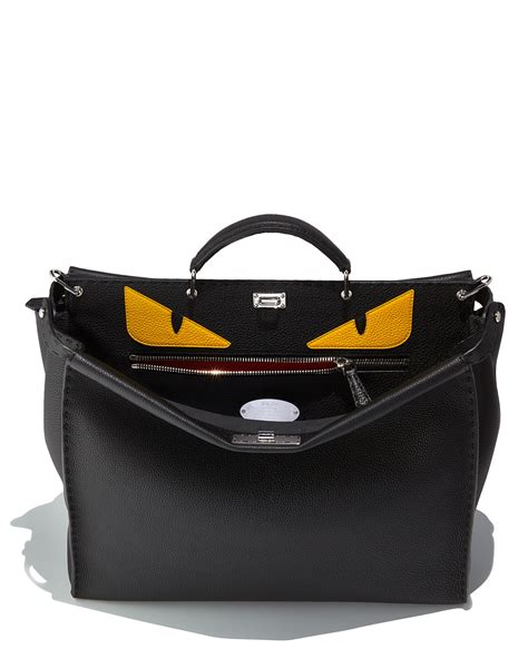 fendi monster eyes look like dragon toothless|Fendi Monster Eyes Peekaboo Bag, Black/Yellow .